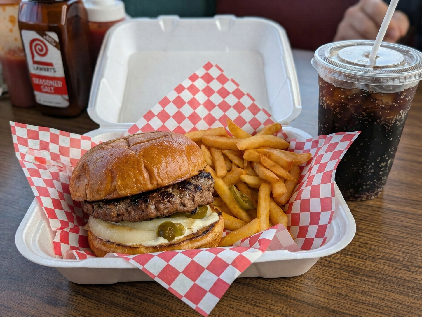 One Stop burger and fries in a red-checkered basket